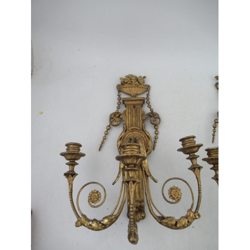 166 - A pair of  Antique Chippendale style wood and gesso gilt three light candelabra surmounted by an urn... 