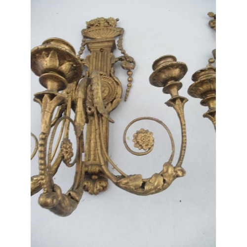 166 - A pair of  Antique Chippendale style wood and gesso gilt three light candelabra surmounted by an urn... 