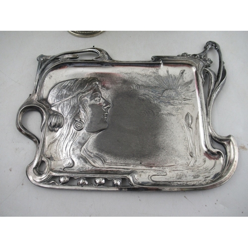 215 - An Art Nouveau silver plated tray, embossed with a girl, 10.5ins x 8ins, together with a WMF pedesta... 