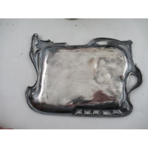 215 - An Art Nouveau silver plated tray, embossed with a girl, 10.5ins x 8ins, together with a WMF pedesta... 