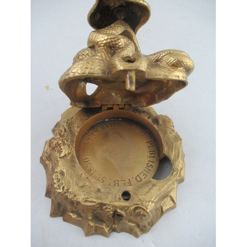 216 - Ben W Hawkins, Published Feb 5th 1850, A gilt metal novelty compass, modelled as a cherub standing o... 