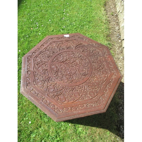 22 - An Eastern design carved  occasional table, with octagonal top, width 24ins, height 25ins