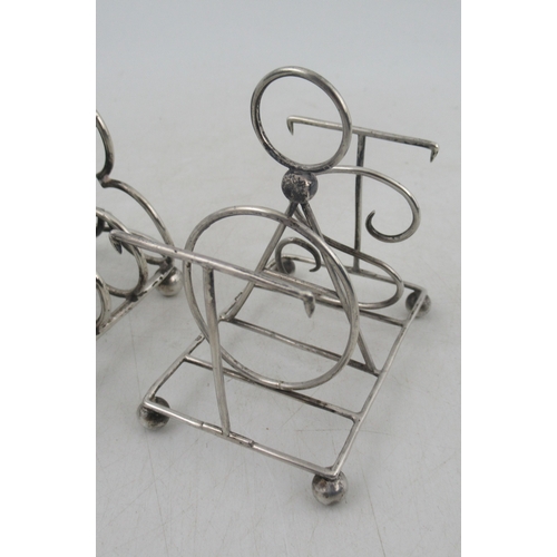 234 - Three silver five bar toast racks, one with bars forming letters TOAST, weight 6oz