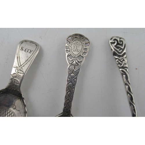 235 - A silver caddy spoon, with Celtic design to the handle, maker Amy Sandheim, together with a Georgian... 