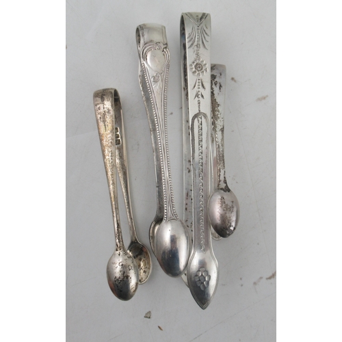 241 - A pair of Georgian silver bright cut sugar tongs, together with three other pairs of sugar tongs, we... 