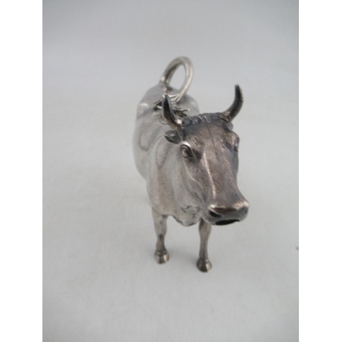 263 - A Victorian silver cow creamer, modelled as a cow with fly on its back, London 1862, maker George Fo... 