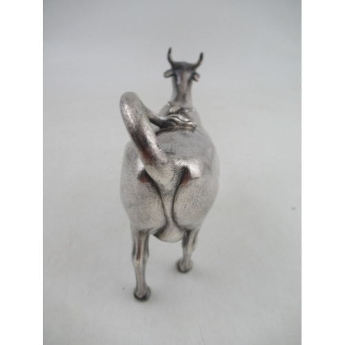 263 - A Victorian silver cow creamer, modelled as a cow with fly on its back, London 1862, maker George Fo... 