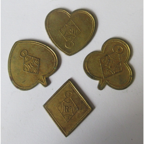 285 - A set of four Victorian gilt metal tokens, formed as the four playing card suits