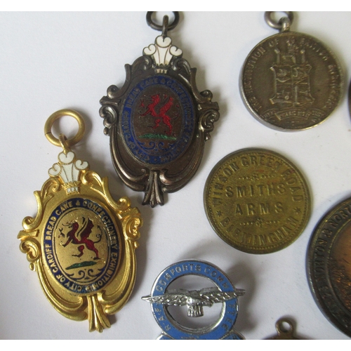 288 - A collection of medals and tokens, to include City of Cardiff Bread, Cake & Confectionary Exhibition... 