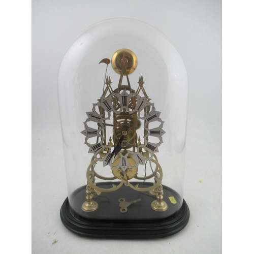 306 - Skeleton Clock with pierced silver Chapter Ring twin chain under a glass dome