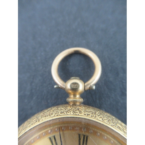 309 - An 18k gold fob watch with floral engraved gold dial, black Roman numerals , engraved shield to the ... 