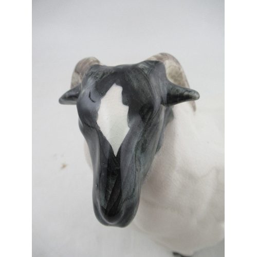 338A - A David Sharp studio pottery model of a Ram width 7ins