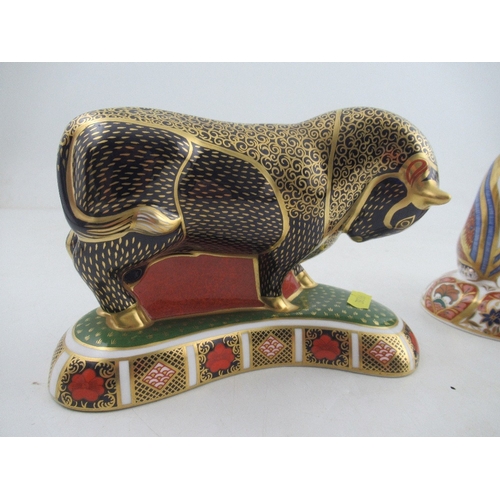 350 - A Royal Crown Derby paperweight of a seated fawn and a standing bull