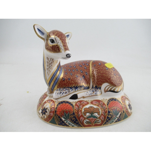 350 - A Royal Crown Derby paperweight of a seated fawn and a standing bull