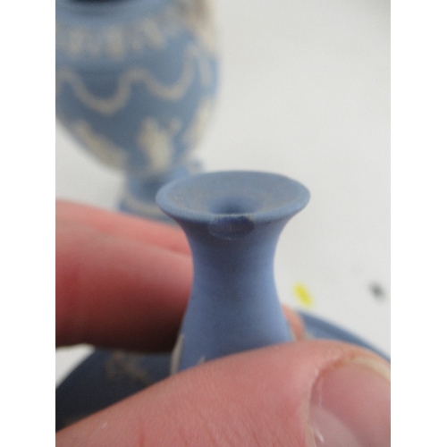 363 - A Wedgewood Blue Jasper covered  vase decorated all around with classical figures and two hoop handl... 