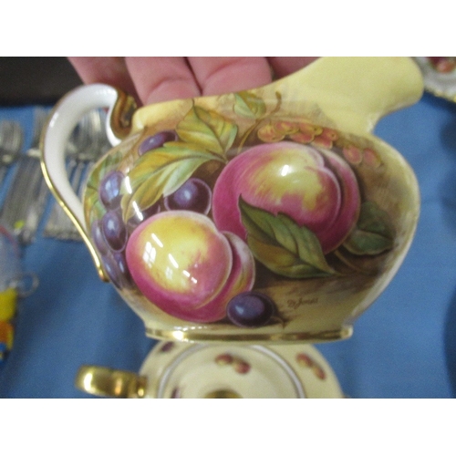 365A - A collection of Aynsley tea ware decorated with fruit to include tea pot, sugar bowl etc