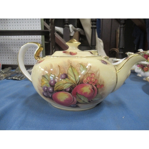 365A - A collection of Aynsley tea ware decorated with fruit to include tea pot, sugar bowl etc