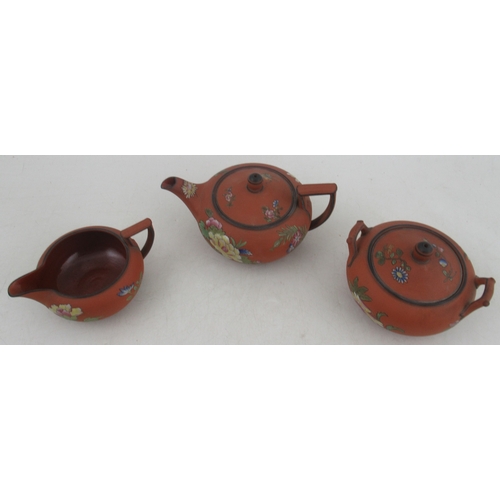 366 - A 19th century Wedgwood terracotta three piece tea set, decorated with flowers