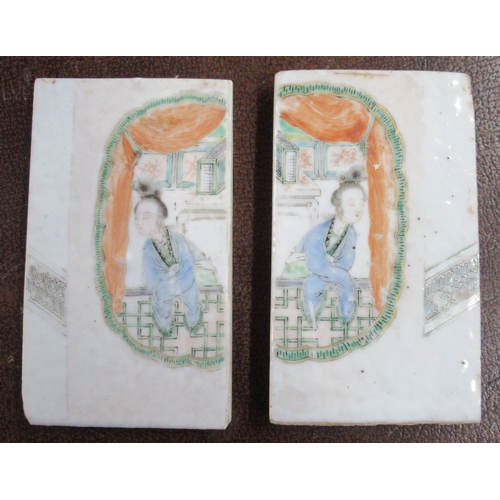 368 - A pair of Oriental porcelain plaques, the two plaques decorated with figures, 4.25ins x 2.5ins each