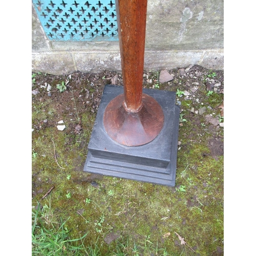 37 - An Arts and Crafts oak standard lamp, raised on a pedestal