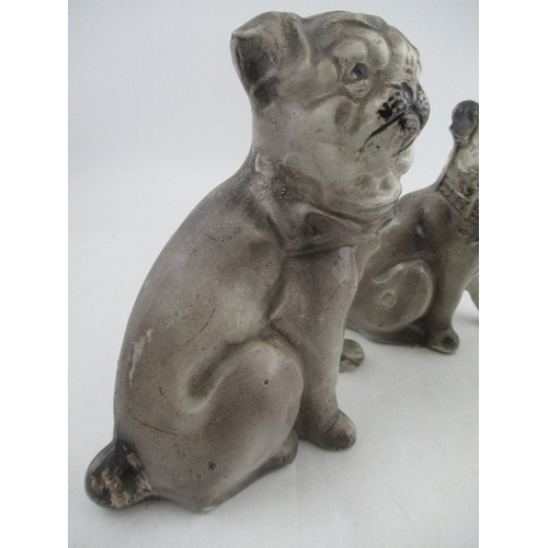 378 - Three porcelain models, of seated dogs, two of pug type dogs, the other of a Staffordshire style poo... 