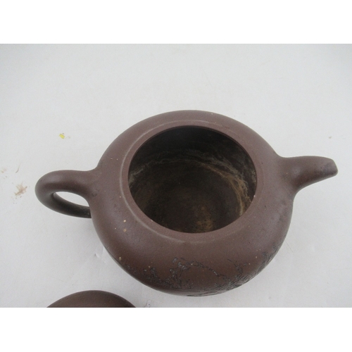 385 - A Chinese Yixing style terracotta teapot, incised with a landscape and script, with seal mark, heigh... 