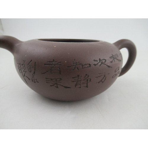 385 - A Chinese Yixing style terracotta teapot, incised with a landscape and script, with seal mark, heigh... 