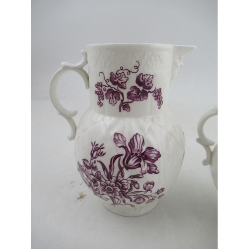 388 - A set of three graduated Royal Worcester jugs decorated with purple flowers to a white ground