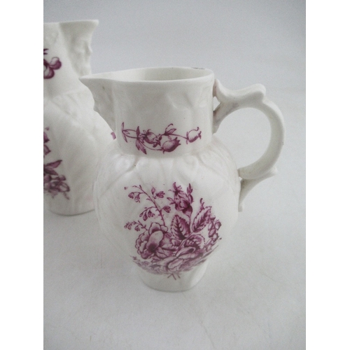 388 - A set of three graduated Royal Worcester jugs decorated with purple flowers to a white ground