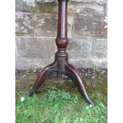 39 - A 19th century oak tilt top tripod table, diameter 27ins