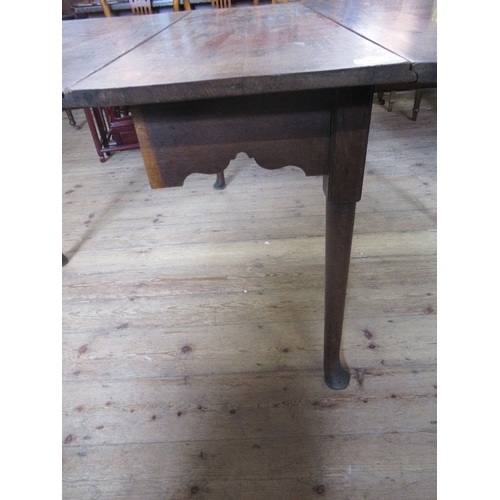 40 - A 19th century oak gate leg table, 62ins x 49ins