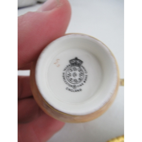 403 - A Royal Worcester coffee cup and saucer decorated with fruit by Freeman