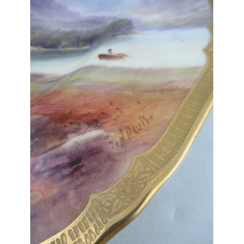 411 - A Royal Worcester plate decorated with a view of Derwent Water by Harry Davies to a gilt boarder dia... 