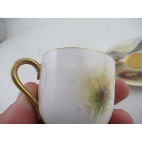 416 - A Royal Worcester coffee cup and saucer decorated with cattle by H Stinton together with a coffee cu... 