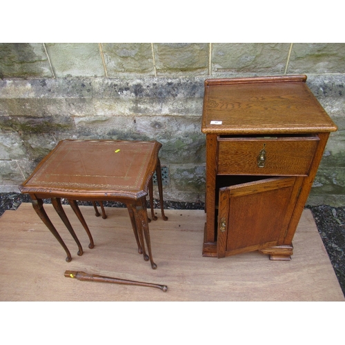 42 - An oak bedside cabinet, width 17ins, together with a nest of tables