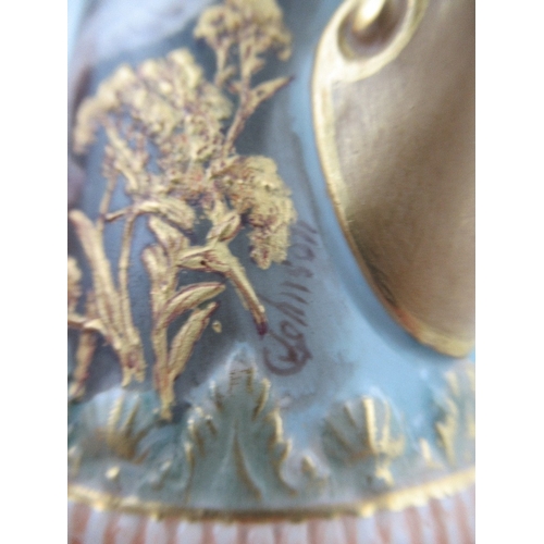 421 - A pair of left and Right Royal Worcester jugs each decorated with four swans on a powder blue ground... 