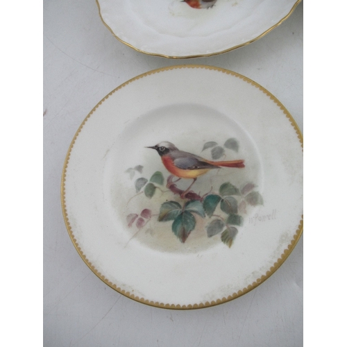 423 - Two Royal Worcester miniature plates decorated with a Red Start, Black bird, Robin and a Linnet by P... 