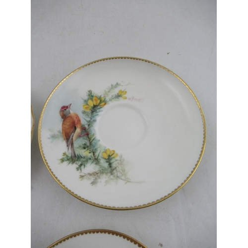 423 - Two Royal Worcester miniature plates decorated with a Red Start, Black bird, Robin and a Linnet by P... 