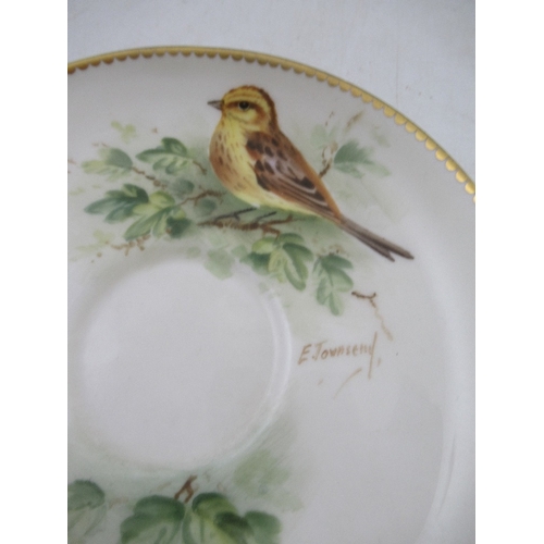 424 - A Royal  Worcester tea cup decorated with a robin by Powell , a  saucer decorated with a Yellow Bunt... 