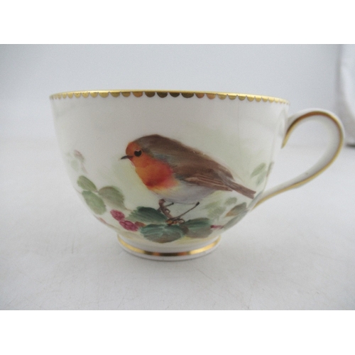 424 - A Royal  Worcester tea cup decorated with a robin by Powell , a  saucer decorated with a Yellow Bunt... 