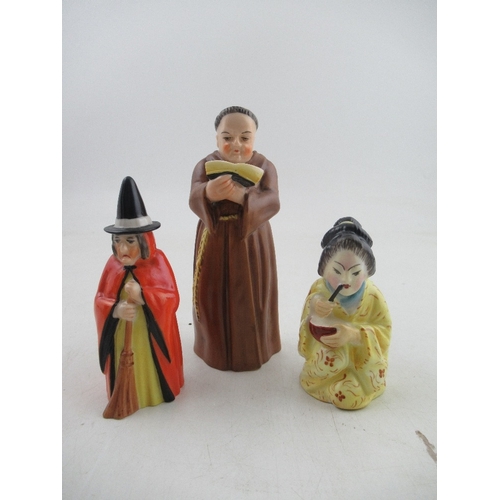 426 - Three Royal Worcester candle snuffers, a monk, a witch and a Japanese girl