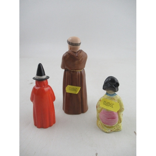 426 - Three Royal Worcester candle snuffers, a monk, a witch and a Japanese girl