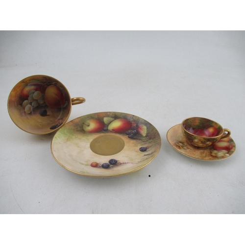 430 - A Royal Worcester tea cup and saucer decorated with fruit by Austin and Price together with a miniat... 