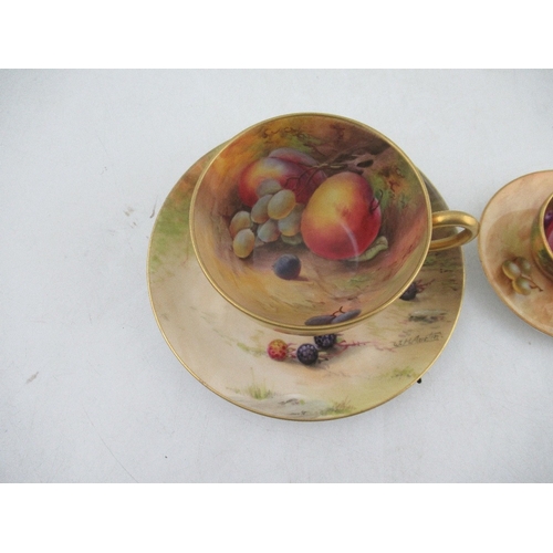 430 - A Royal Worcester tea cup and saucer decorated with fruit by Austin and Price together with a miniat... 