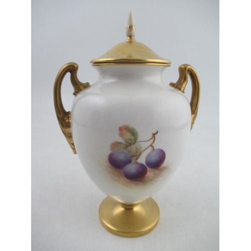 438 - A Royal Worcester porcelain covered vase decorated half round with hand painted fruit by Ayrton Shap... 