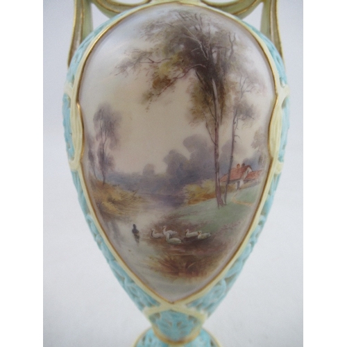 443 - A Grainger's  Worcester turquoise pierced vase with reserved landscape panels, height 7.5ins