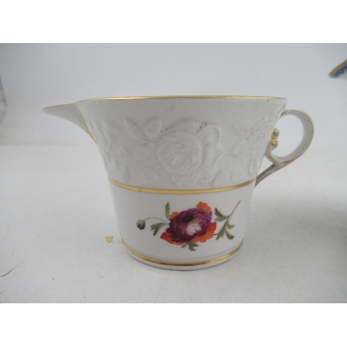 451 - A Chamberlains cream jug with molded boarder and flowers below together with a Gaingers milk jug dec... 