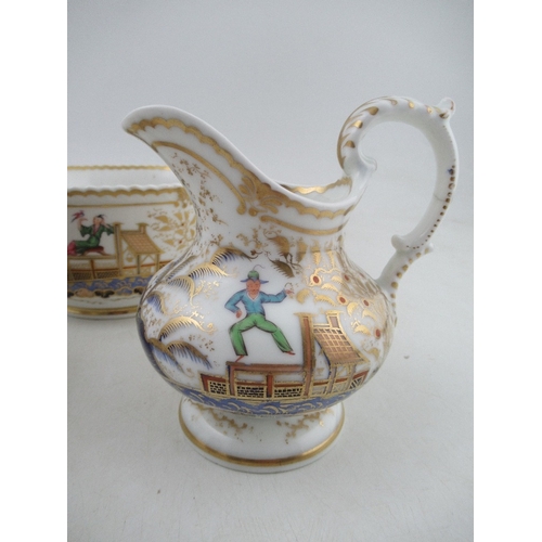 454 - A Chamberlains Worcester tea cup and saucer, slop bowl and milk jug all decorated with the acrobat p... 