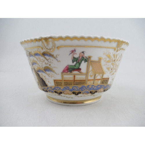 454 - A Chamberlains Worcester tea cup and saucer, slop bowl and milk jug all decorated with the acrobat p... 