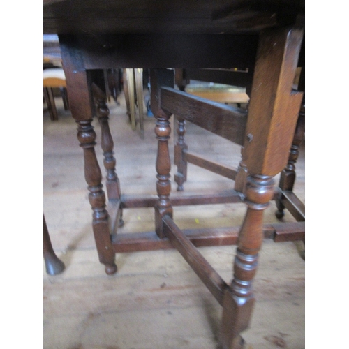 46 - An Antique oak gate leg table, width 33ins